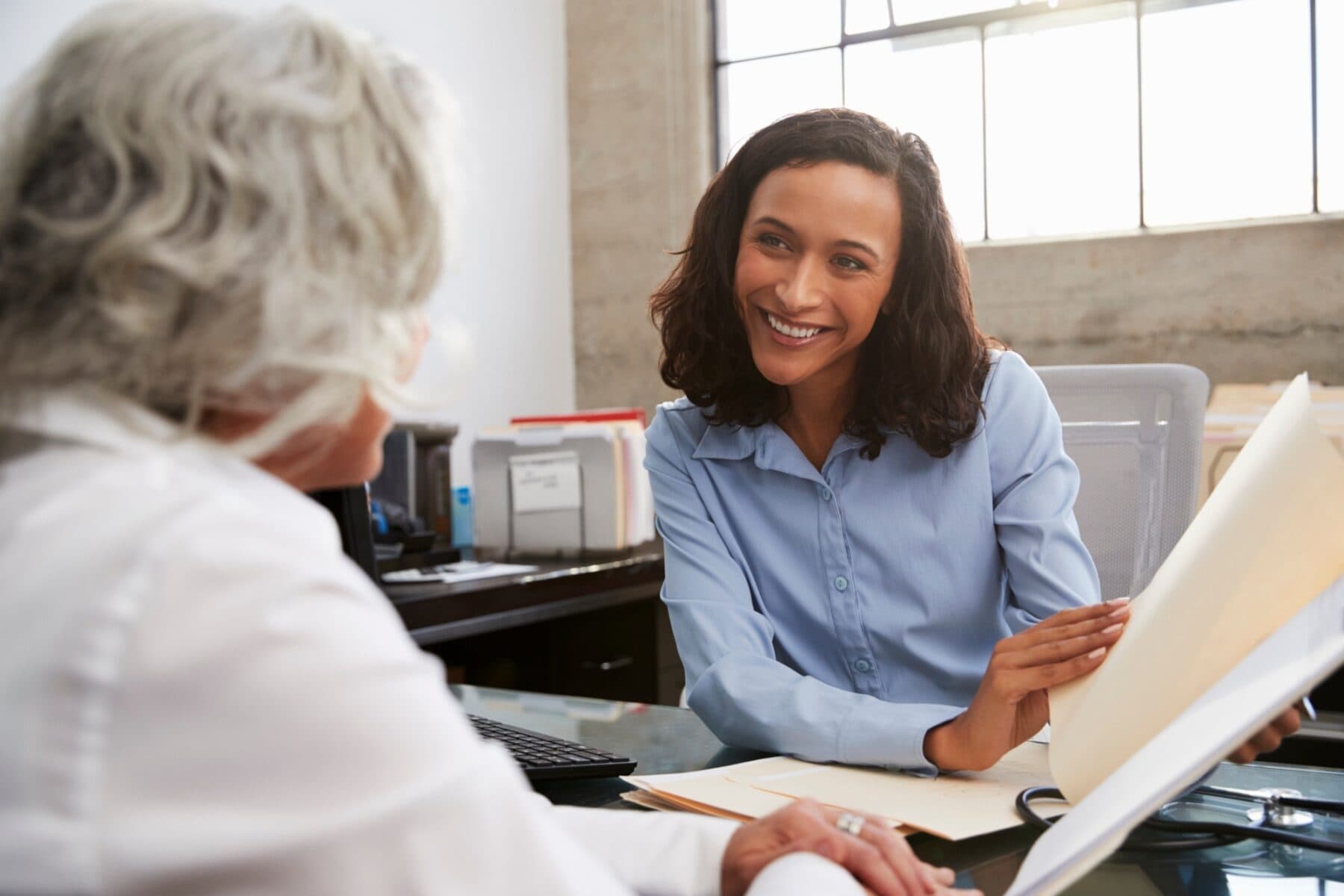 female consultant in consultation with a senior patient